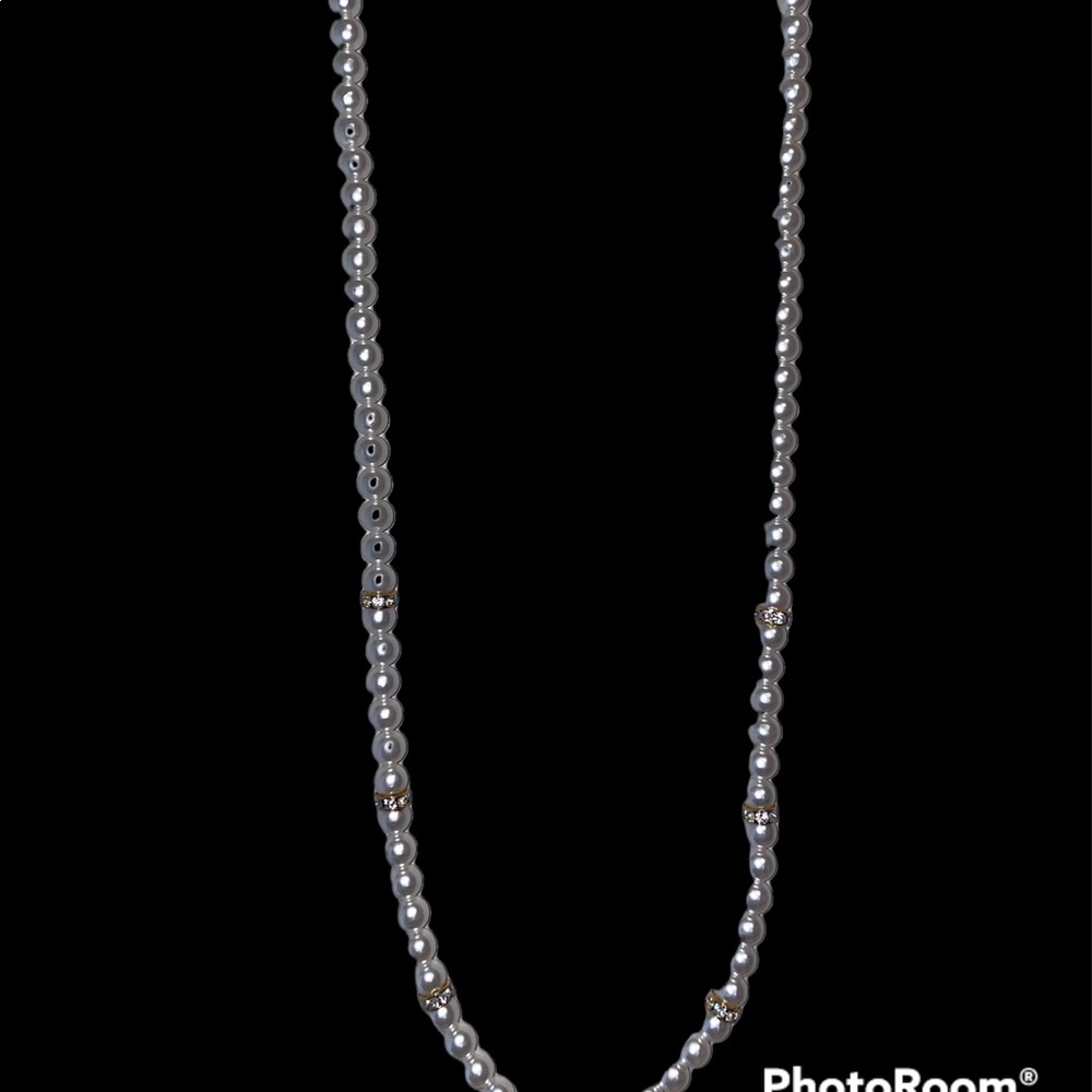 Long pearl necklace with diamond accent